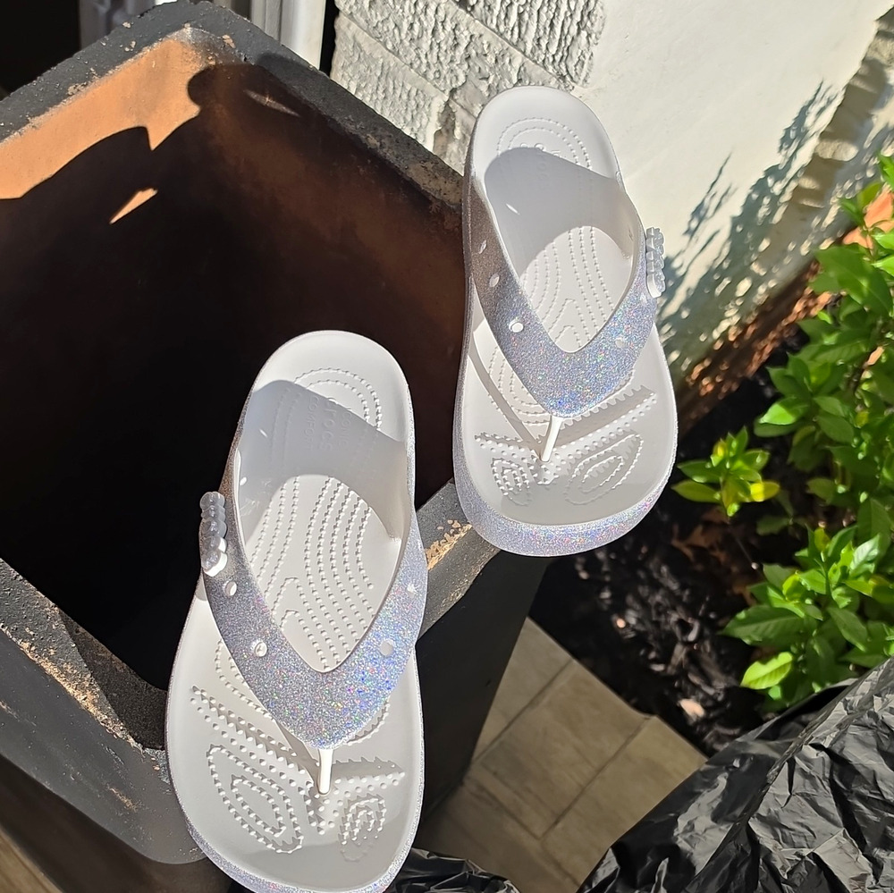 Crocs Classic Platform Glitter Flip in the White / Silver colorway. Women's 9